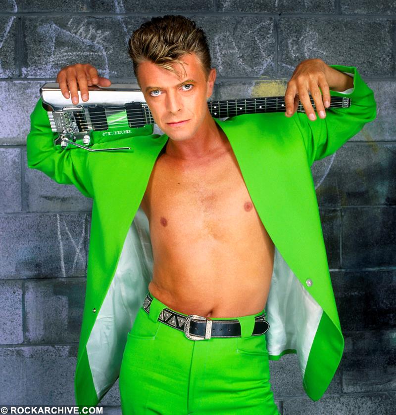 David Bowie wearing a green Thierry Mugler suit photographed by Brian Aris in Dubin in 1991