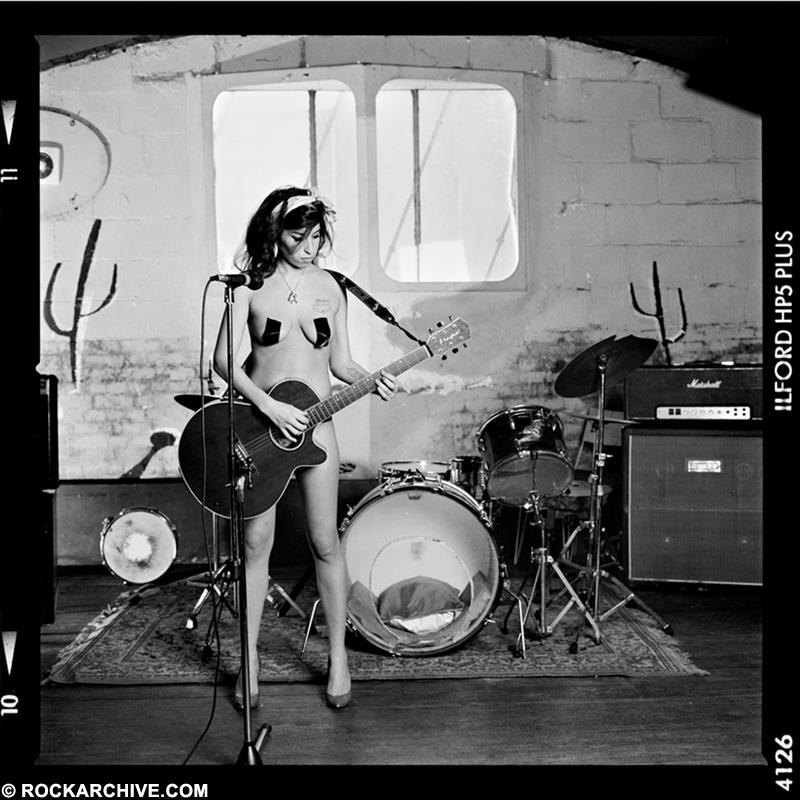 Limited edition print of Amy Winehouse nude whilst holding a guitar in 2005