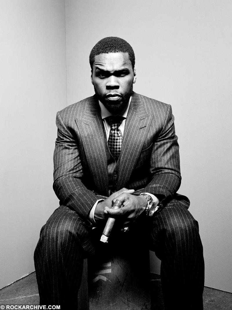 Limited edition of 50 Cent sat in a corner wearing a suit in 2008.