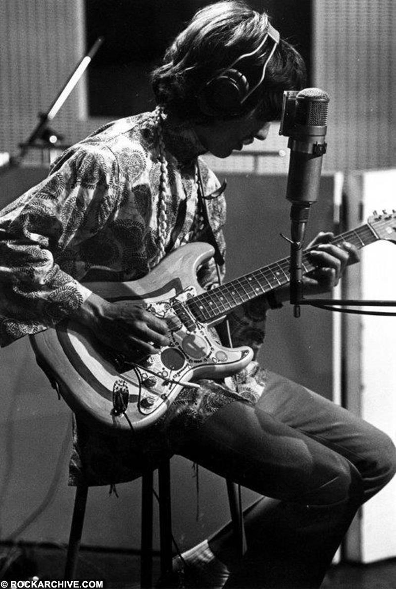 Limited edition print of George Harrison playing guitar in 1967.