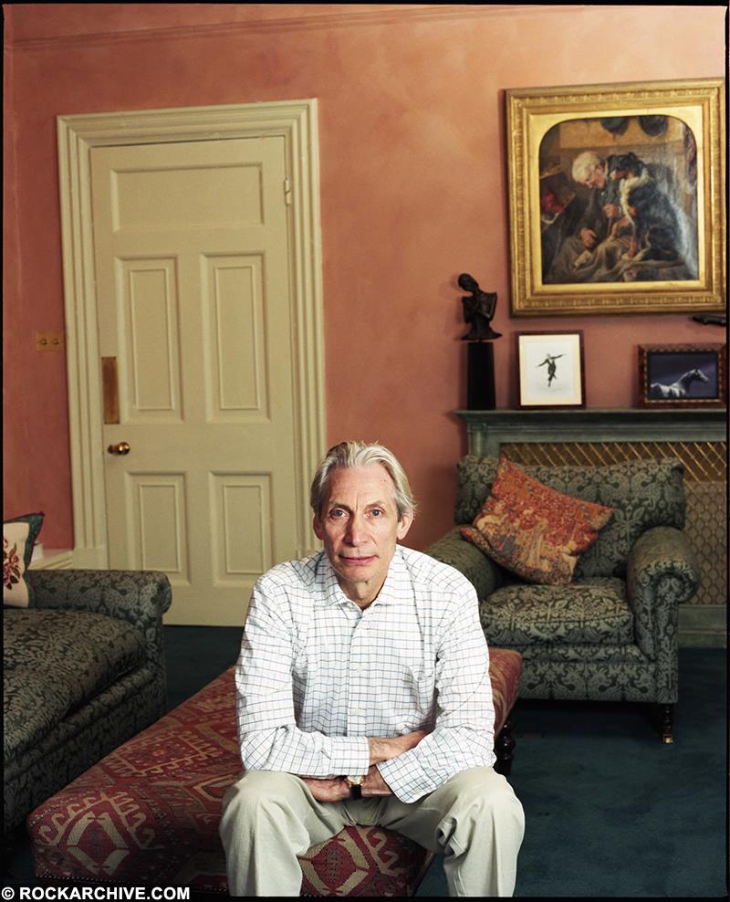 A limited edition colour print of Charlie Watts from the Rolling Stones sitting in the living room of his London home.
