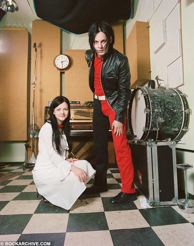 A limited edition colour print of Jack & Meg White of the White Stripes by a selection of musical instruments.