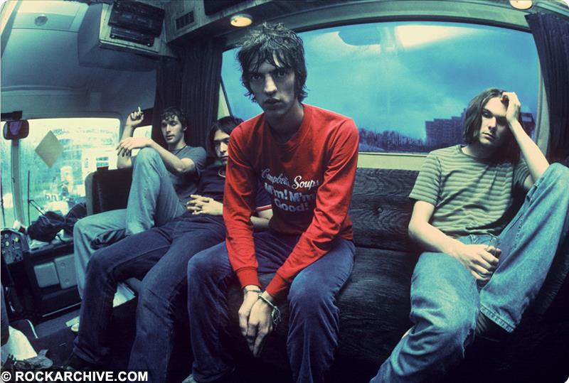 A limited edition colour print of The Verve sat on their tour bus in 1994.