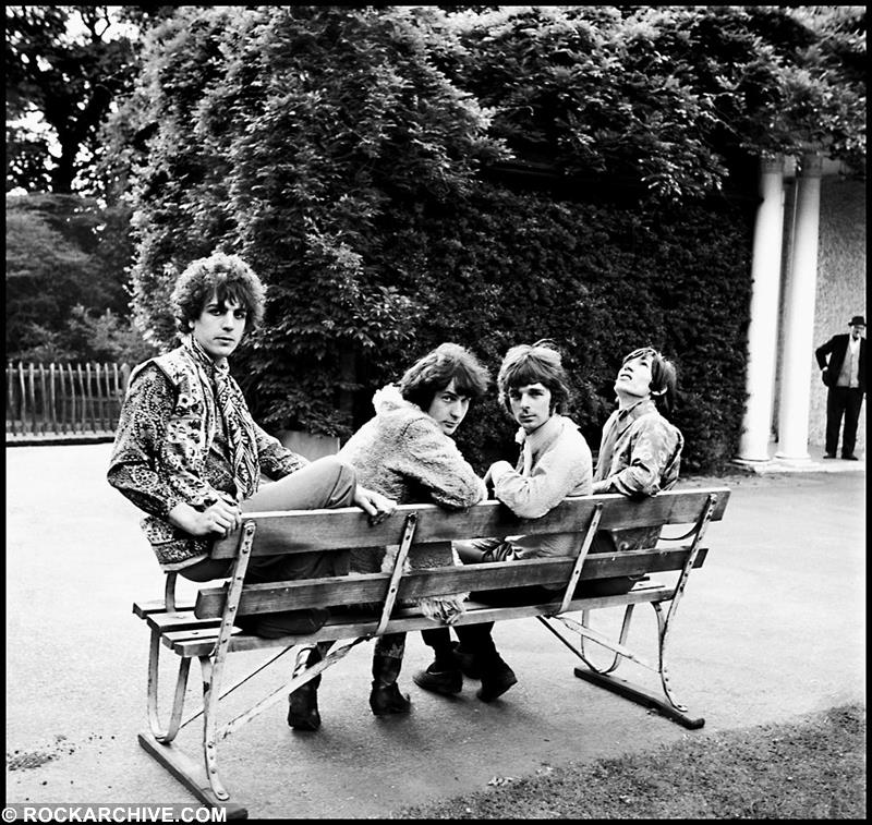 A Rockarchive limited edition print of Syd Mason, Nick Mason, Roger Waters and Rick Wright sitting on a park bench.