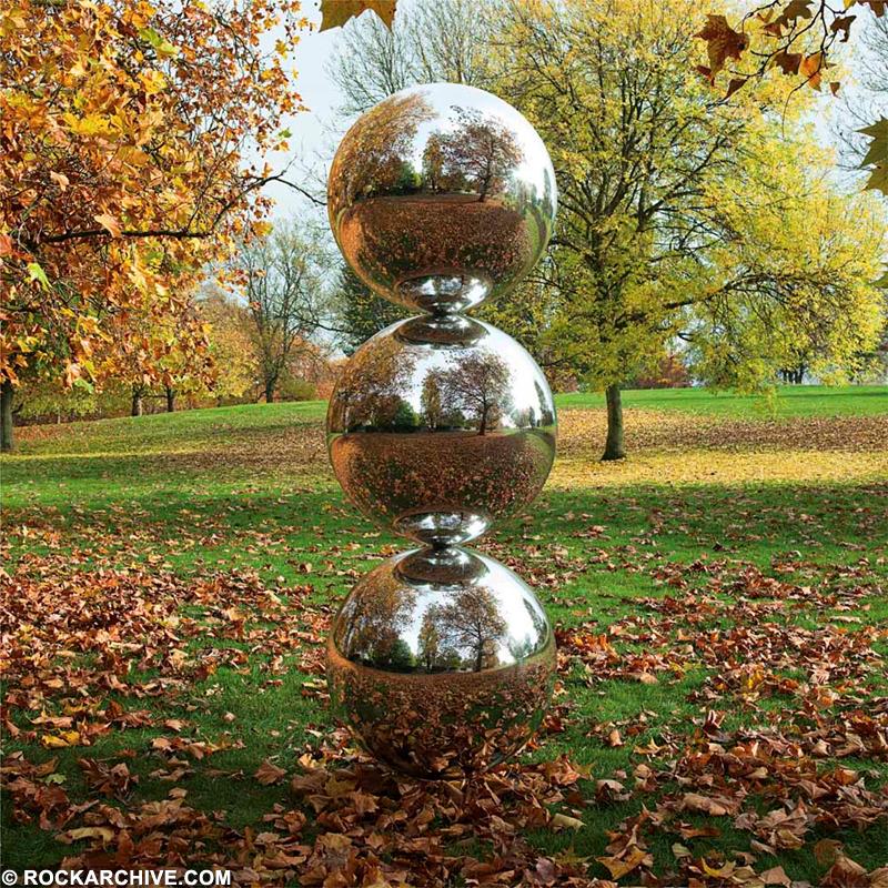 A Rockarchive limited edition print featuring three giant metal balls stacked on top of each other created by Storm Thorgerson for Pink Floyd's Interstellar exhibition.