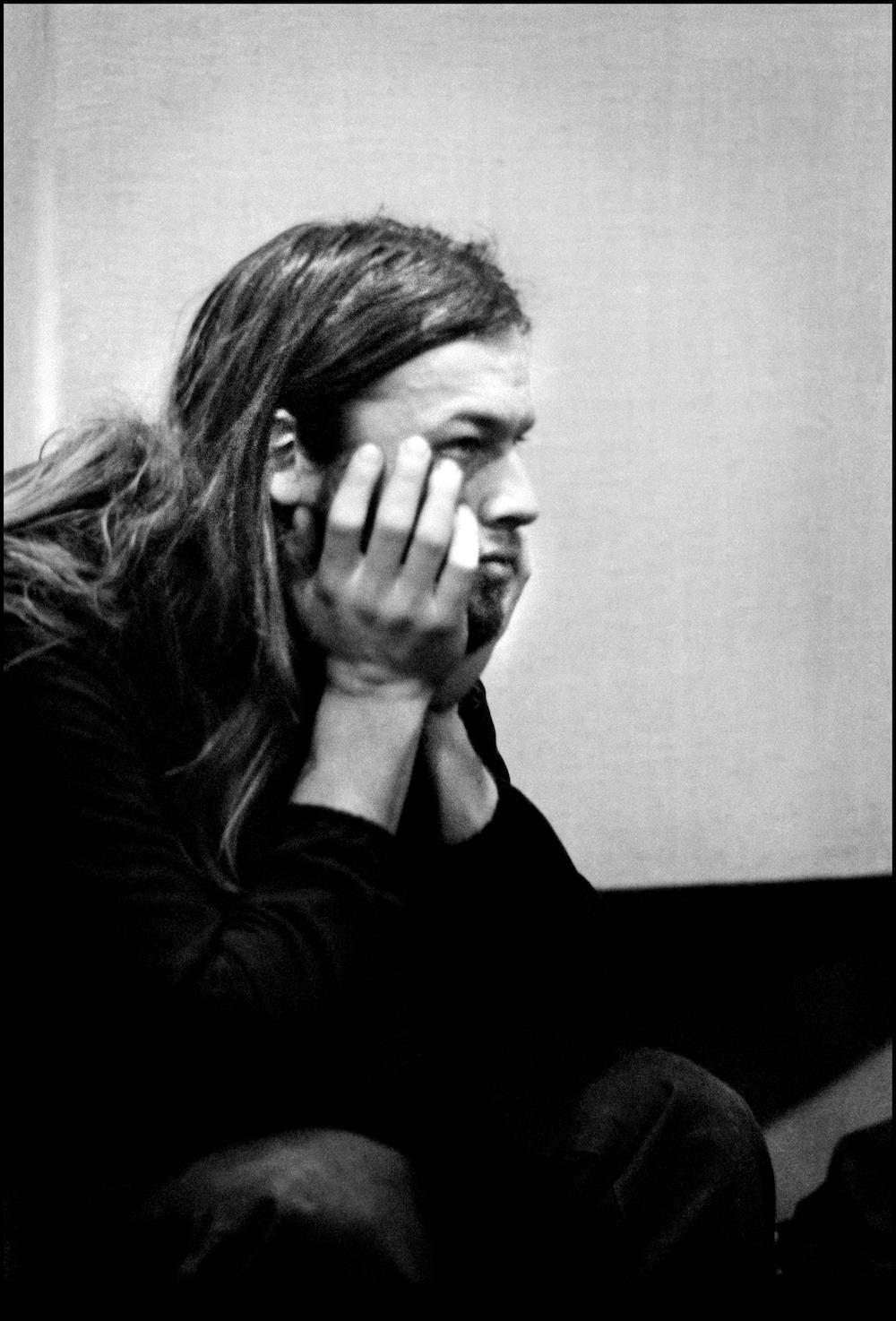 A Rockarchive limited edition print of David Gilmour relaxing with his elbows on his knees.