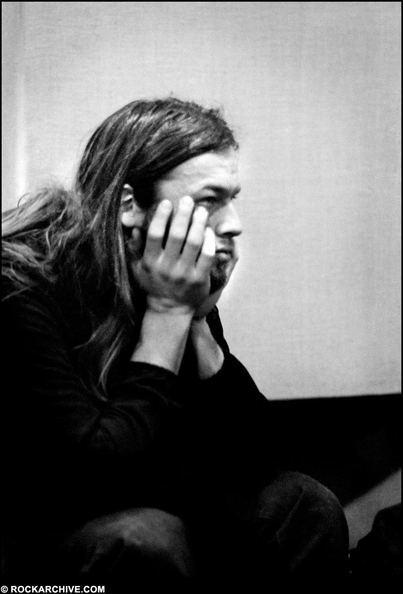 A Rockarchive limited edition print of David Gilmour relaxing with his elbows on his knees.