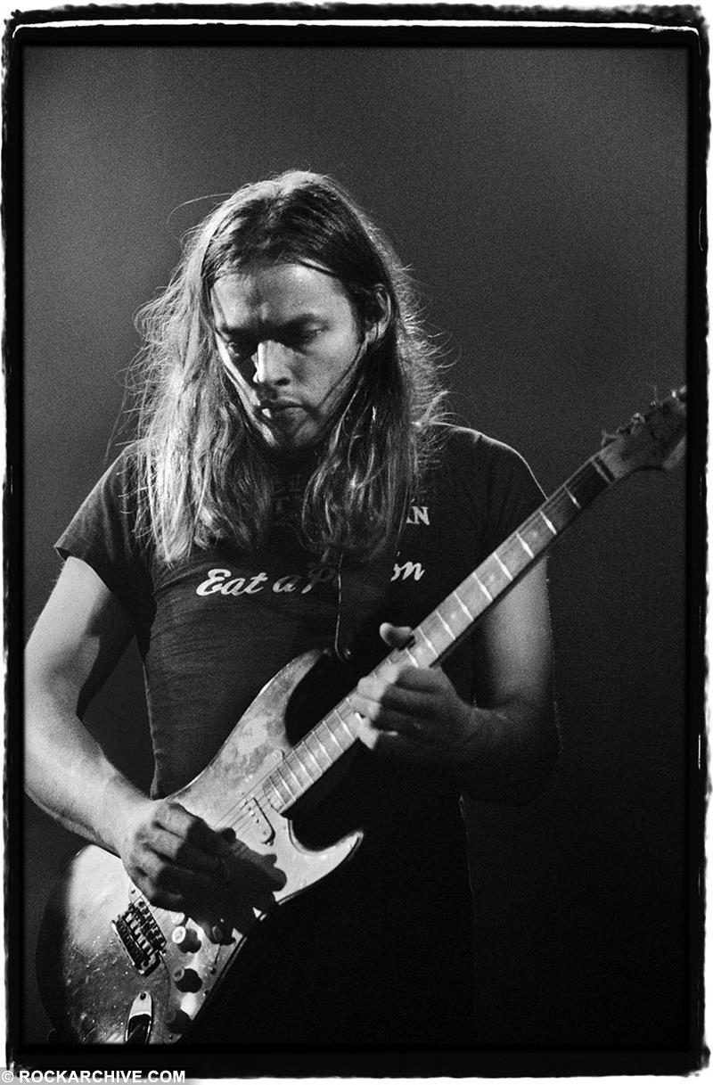 A Rockarchive limited edition print of David Gilmour playing his iconic 'black strat' guitar in 1973.