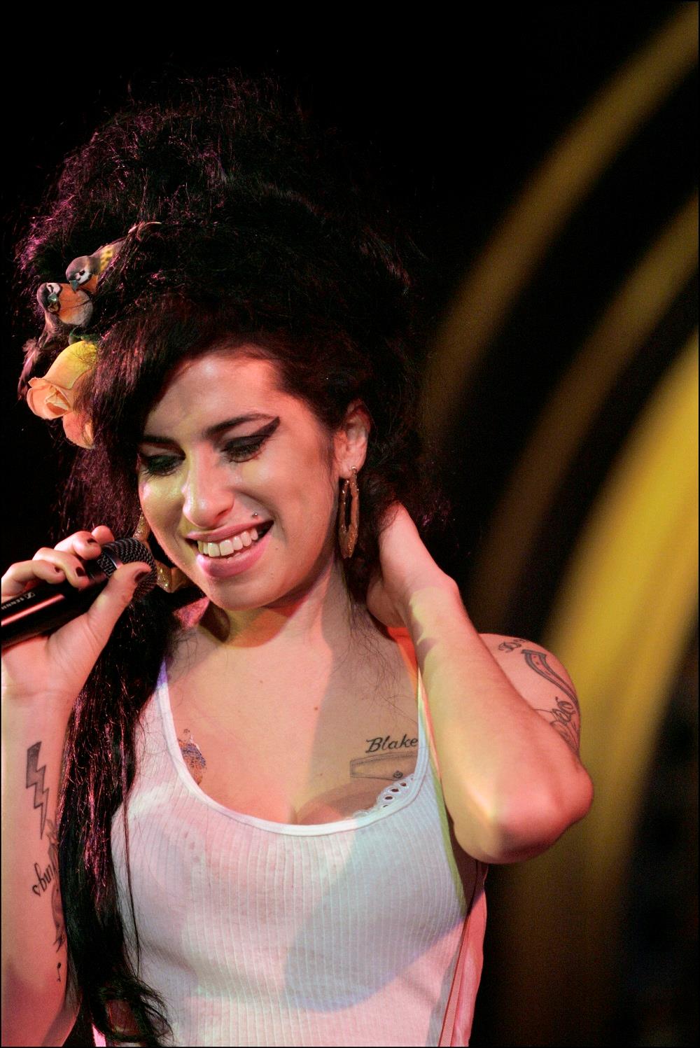Colour photograph of Amy Winehouse performing at the Union Chapel in 2006 shot by Jill Furmanovsky