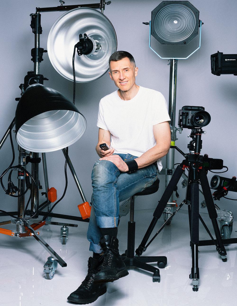 Photographer Markus Klinko pictured by his equipment