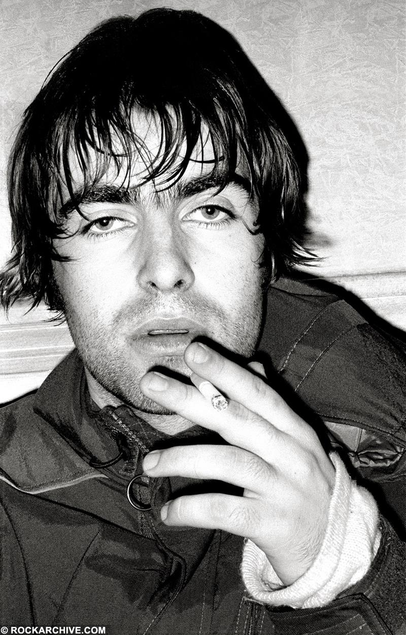 Liam Gallagher smoking at Creation Record's Christmas Party in 1995