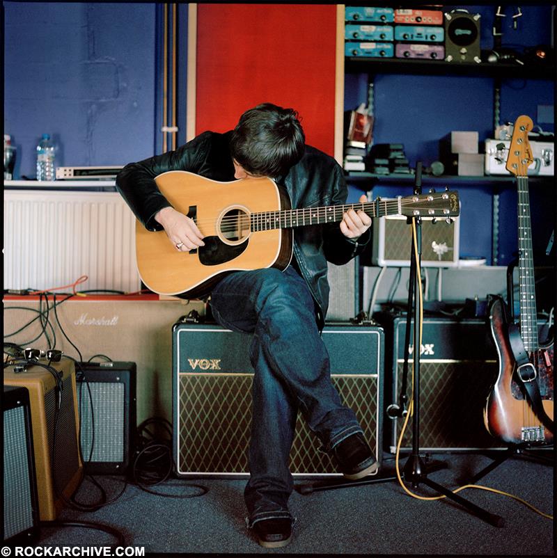 Noel Gallagher playing guitar at Wheeler End Studio in April 2004.