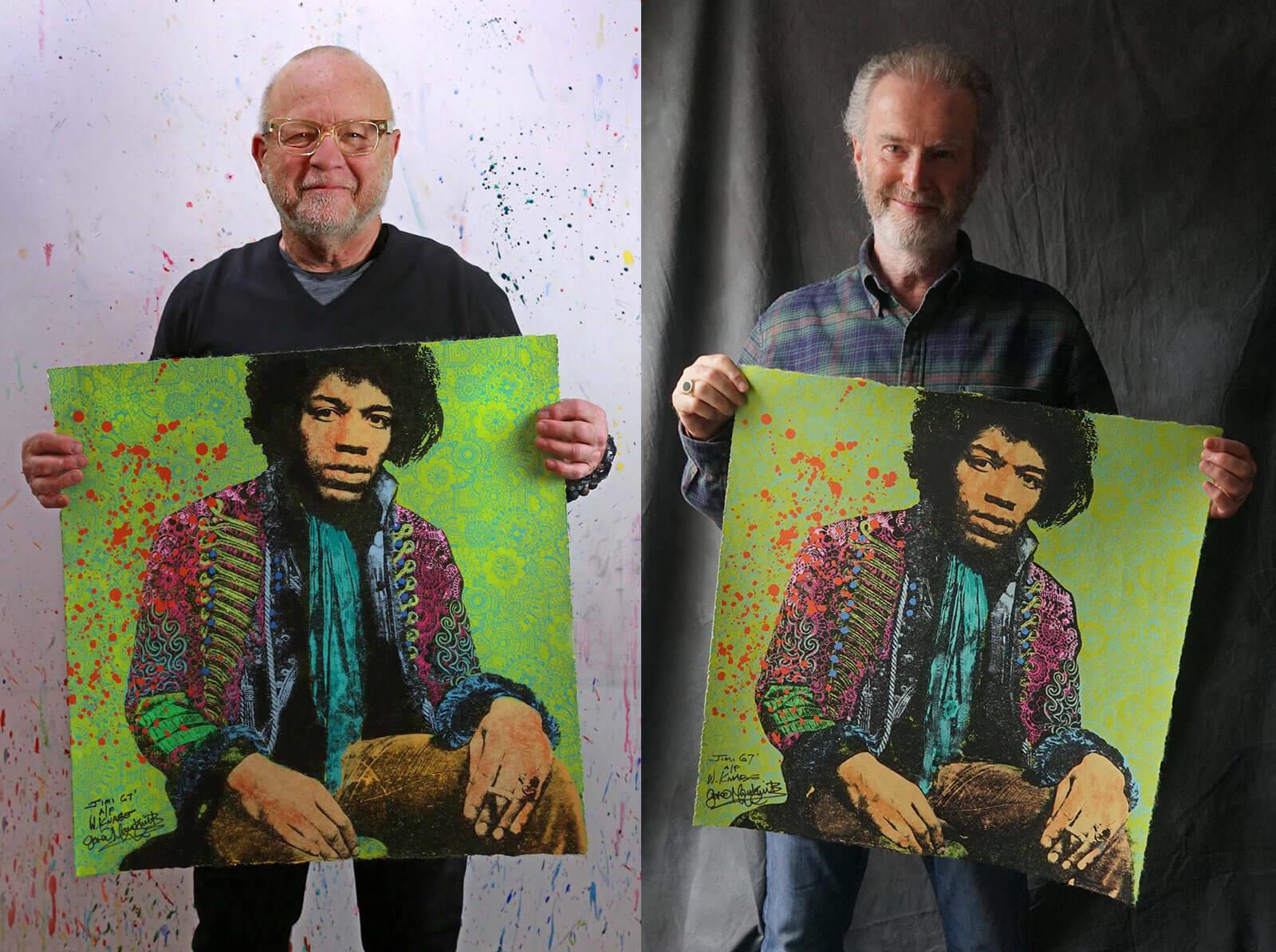 Walter Knabe and Gered Mankowitz holding their Jimi Hendrix collaboration artwork