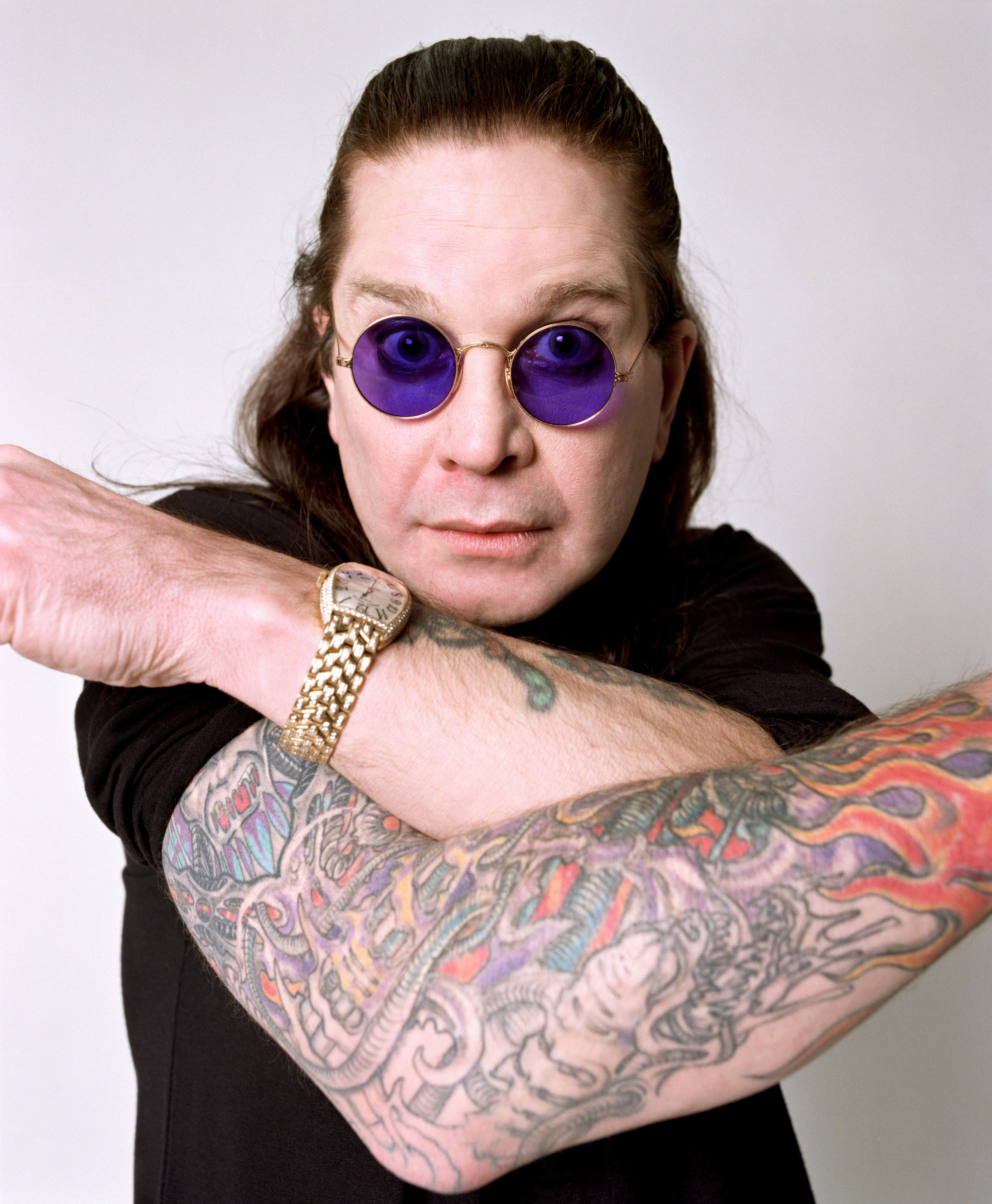 Limited edition print of Ozzy Osbourne with his arms crossed.