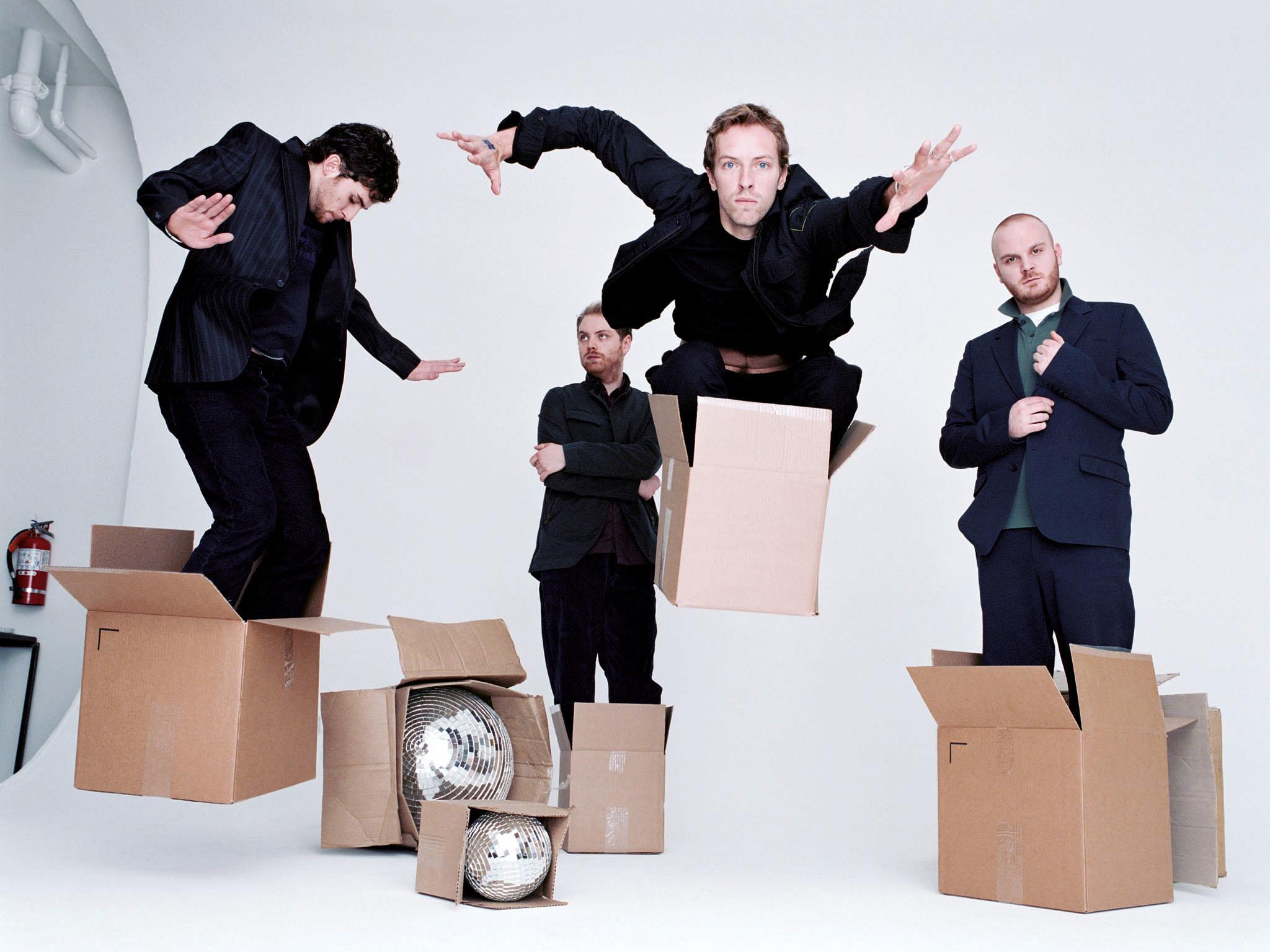 Colour limited edition print of Coldplay stood in cardboard boxes in 2005 photographed by Jake Chessum.