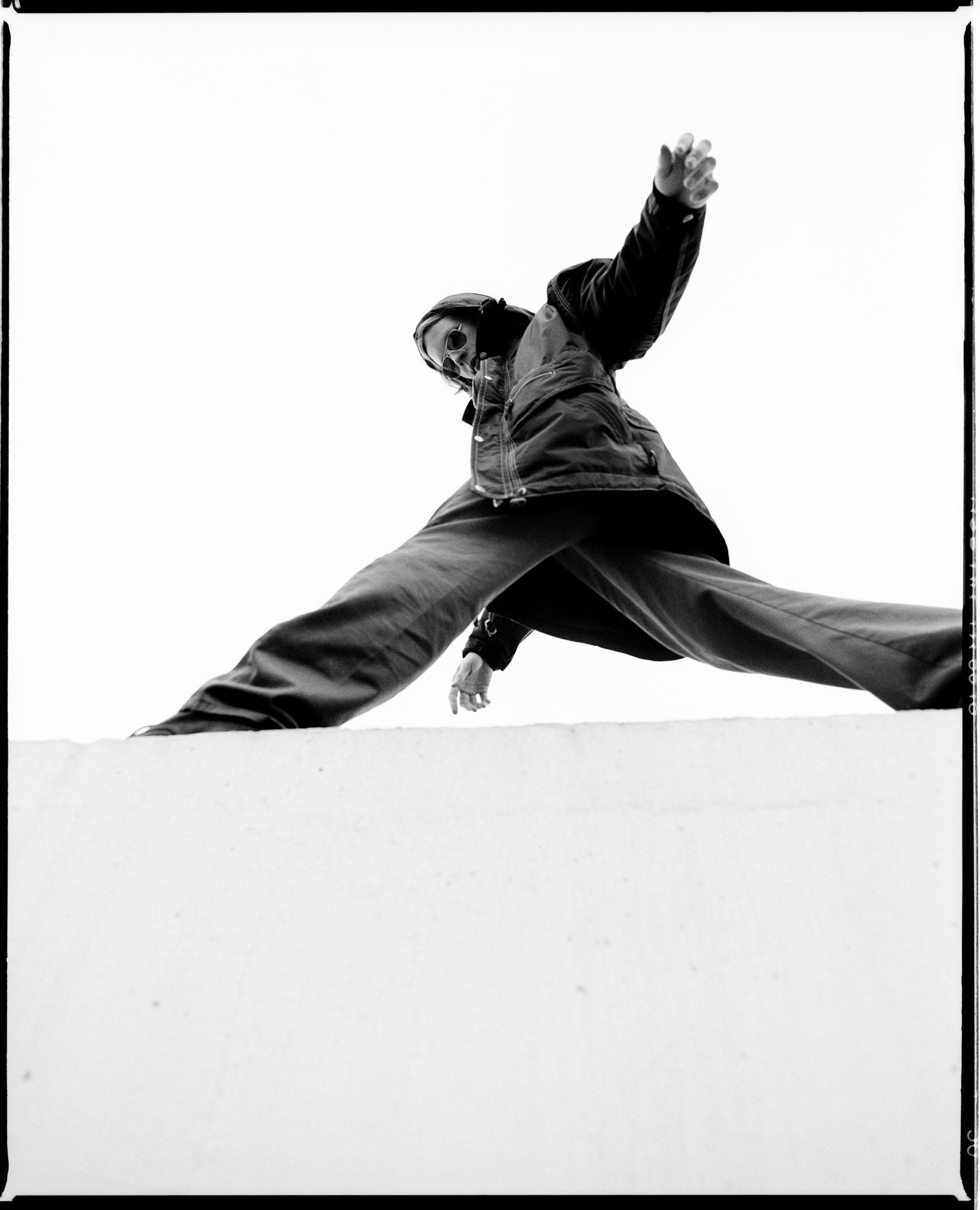 Limited edition print of Beck walking on top of a wall in London in 1994.