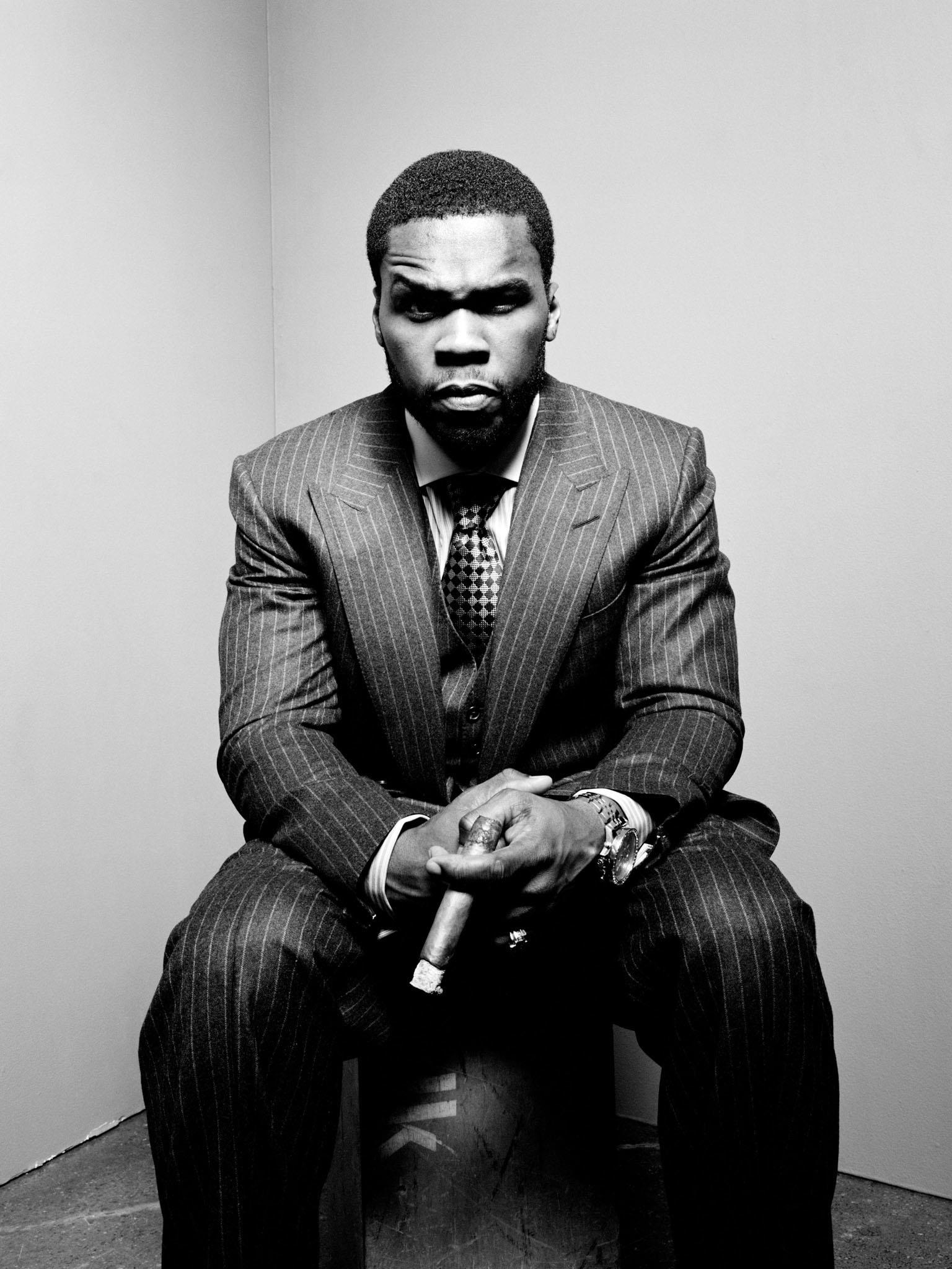 Limited edition of 50 Cent sat in a corner wearing a suit in 2008.