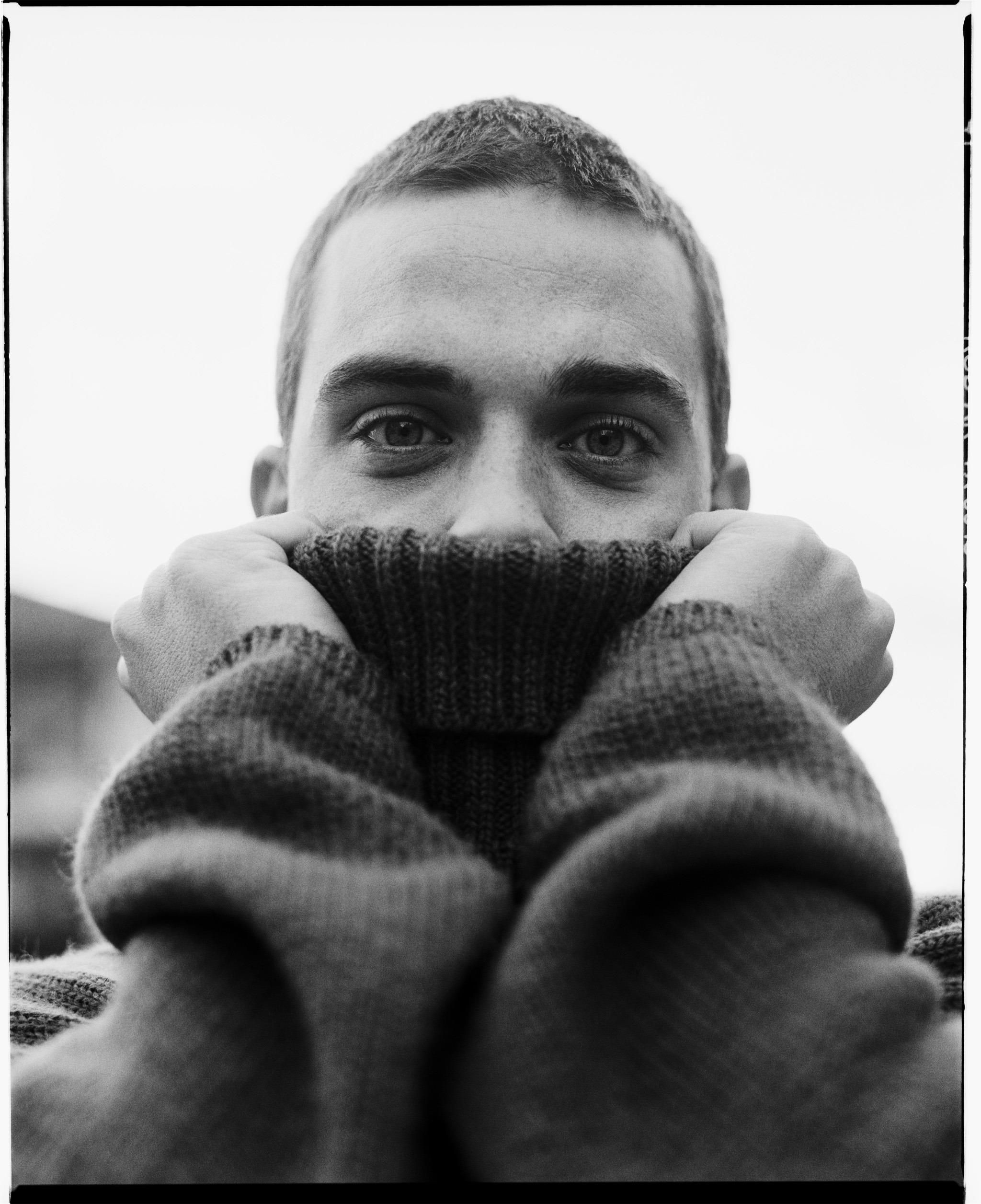 Limited edition print of Robbie Williams with a jumper pulled over his face in 1998.
