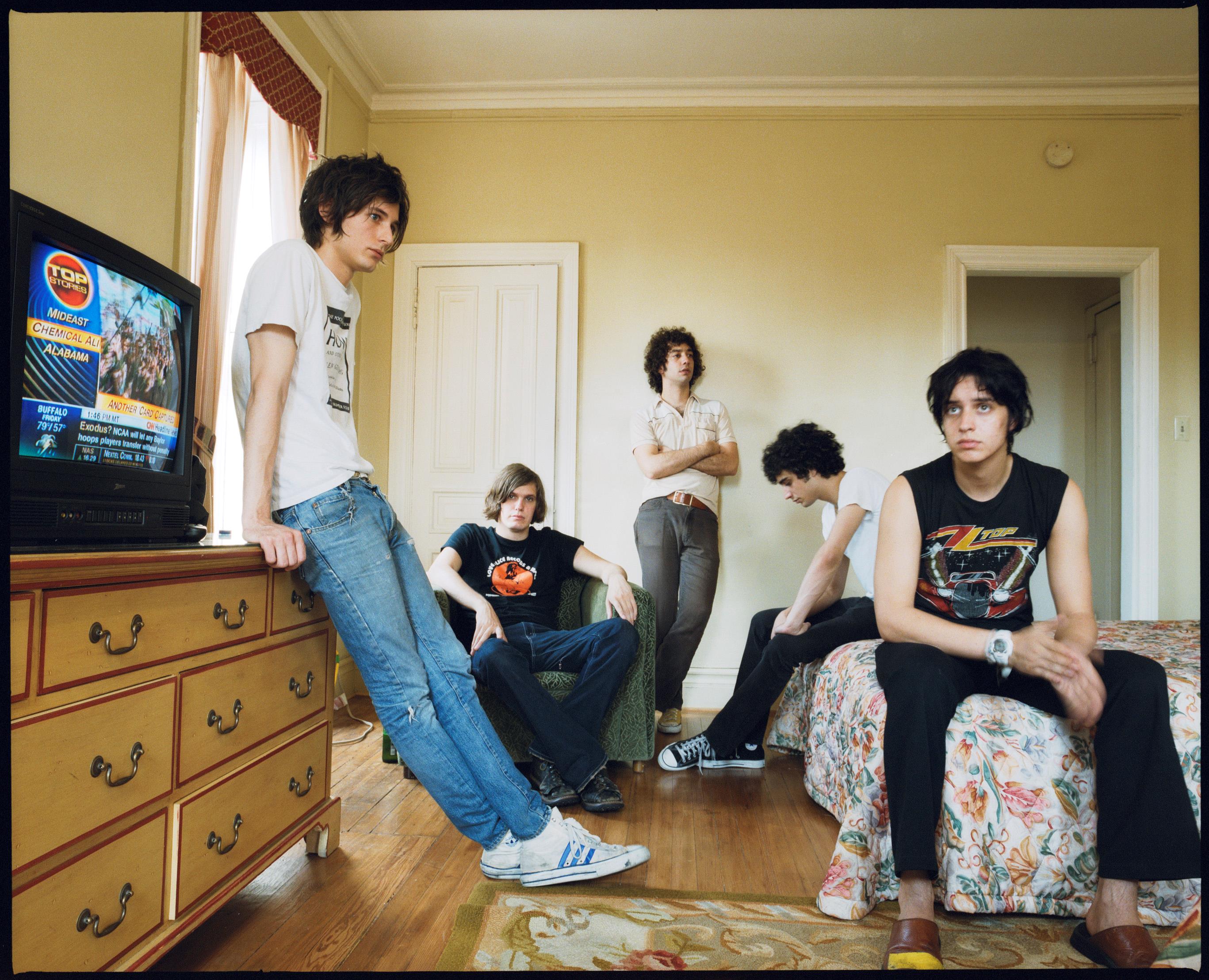 Limited edition colour print of The Strokes stood in a bedrooom in the Chelsea Hotel, New York 2003.