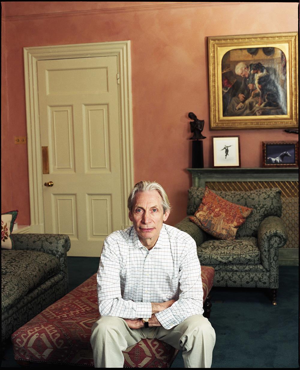 A limited edition colour print of Charlie Watts from the Rolling Stones sitting in the living room of his London home.