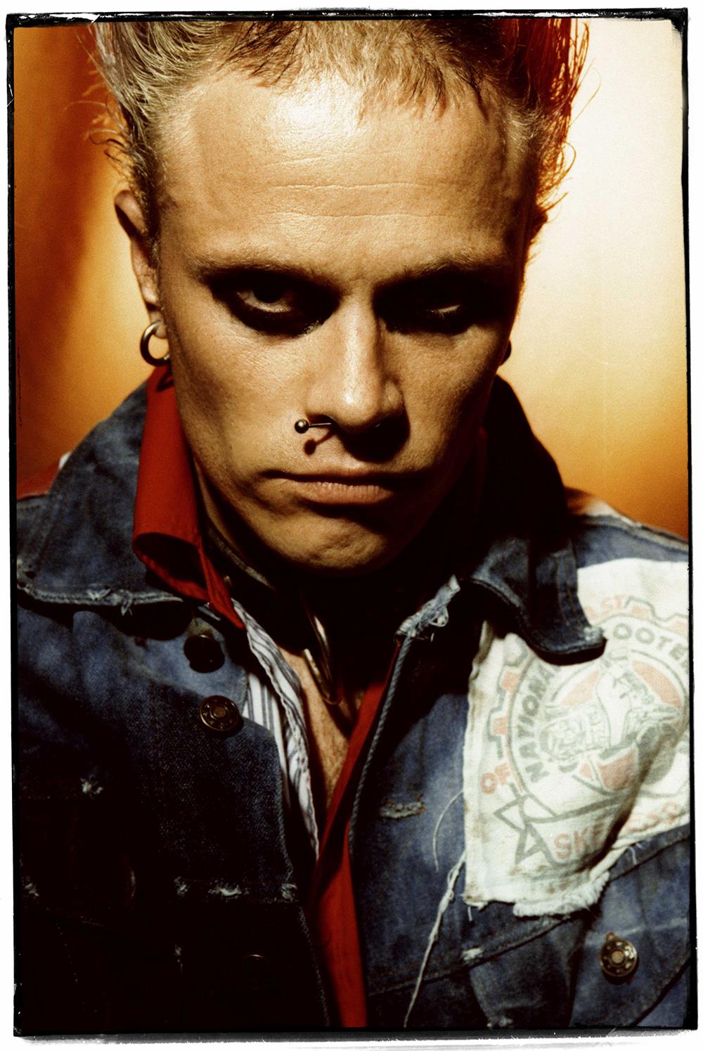 A limited edition colour print of a close up of The Prodigy's frontman Keith Flint wearing a denim jacket.
