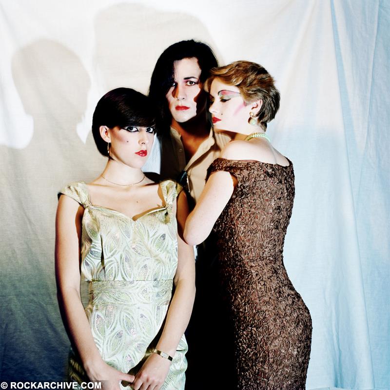 A Rockarchive limited edition colour print of the Human League stood closely together against the background of a white sheet