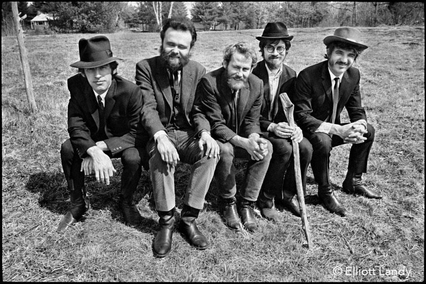 A limited edition print of The Band sat on a bench.