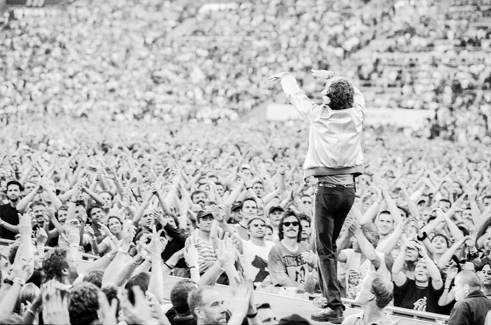 A limited edition print of Mick Jagger of the Rolling Stones looking out at the crowd.