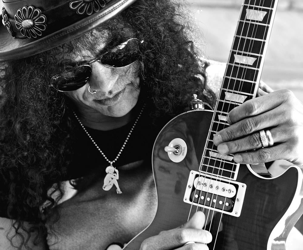A limited edition print of Slash holding a guitar.