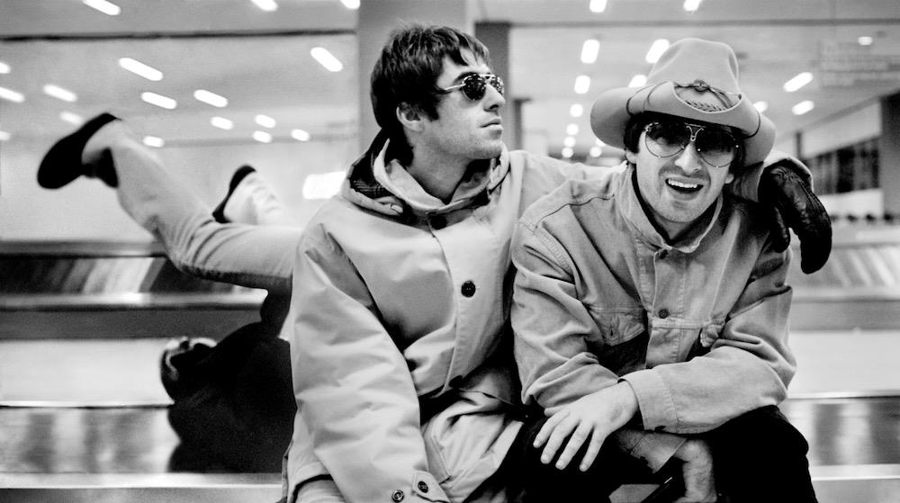 A limited edition print of Oasis sat on the baggage carousel at Schiphol airport in Amsterdam.