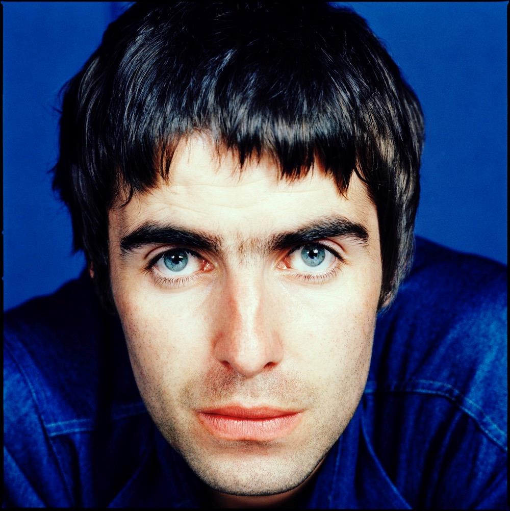 A limited edition colour print of Liam Gallagher, Oasis against a blue background.