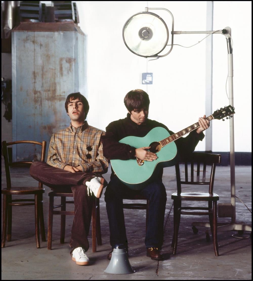 A limited edition colour Rockarchive print of Noel & Liam Gallagher sat together during the Wonderwall video shoot.