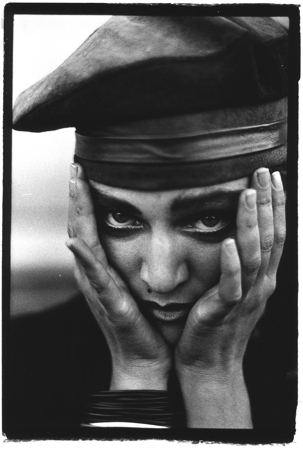 A limited edition print of Madonna with her hands cupping her face.