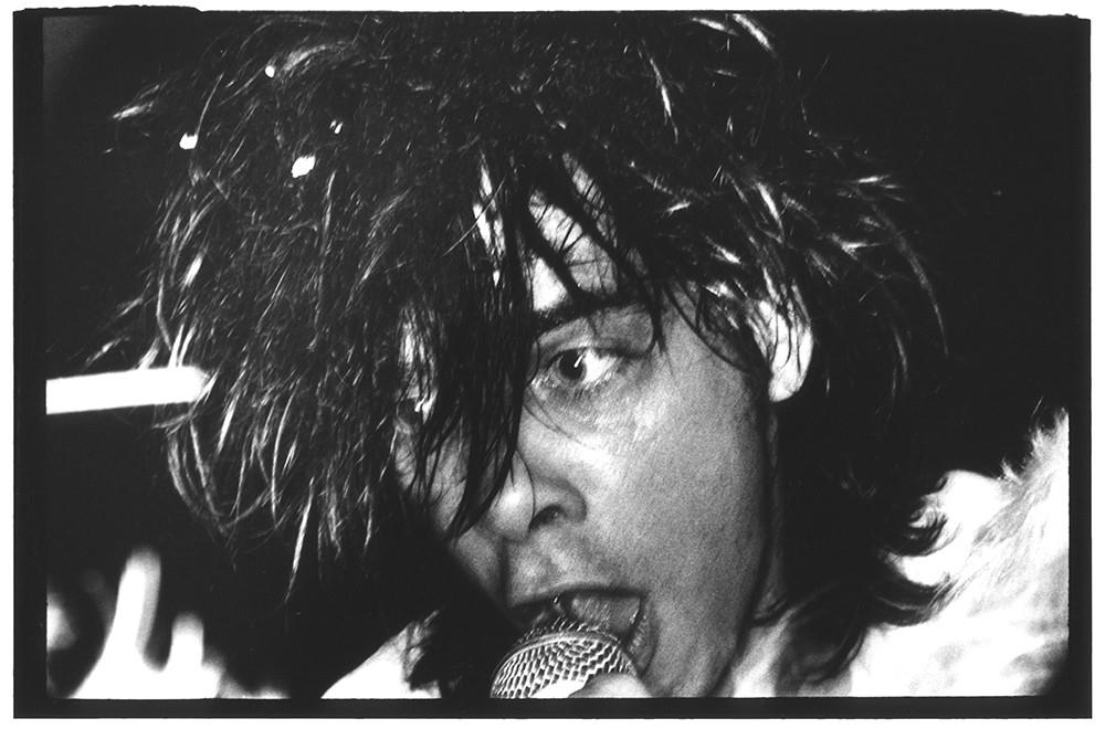 Limited edition print of a close-up portrait of Nick Cave singing into a microphone