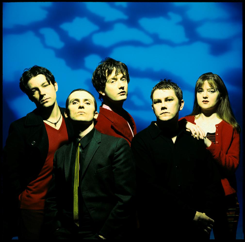 A Rockarchive fine art print of a group shot of Pulp against a blue background.