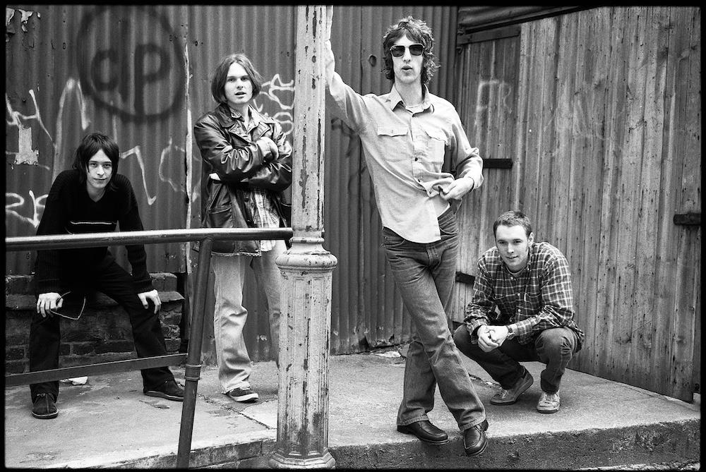 A limited edition print of The Verve stood together.