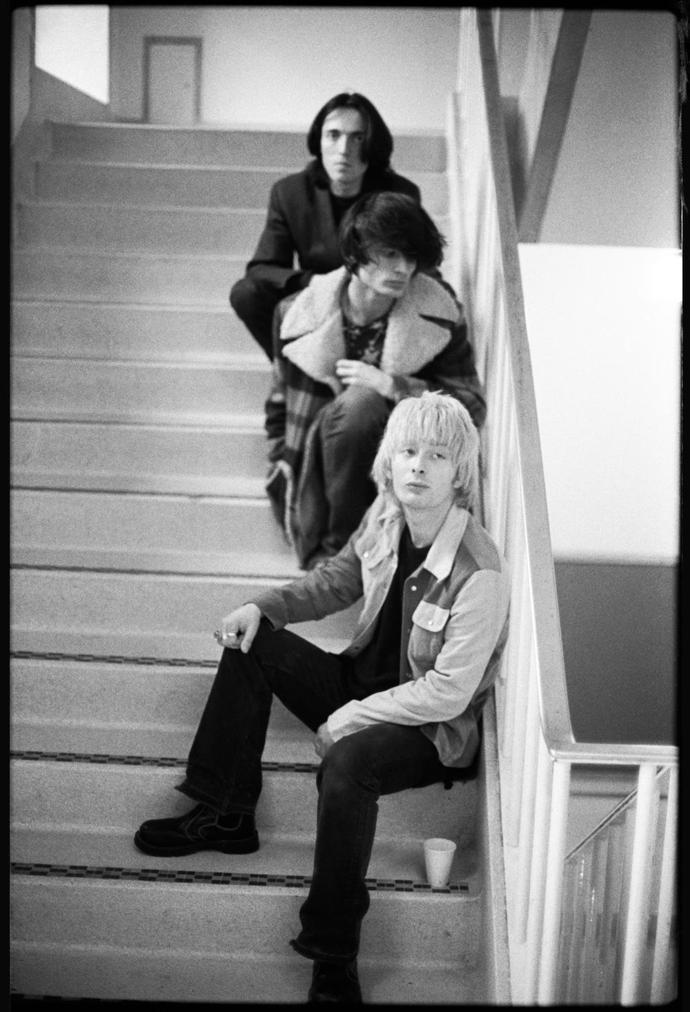A limited edition print of Radiohead sat on the stairs