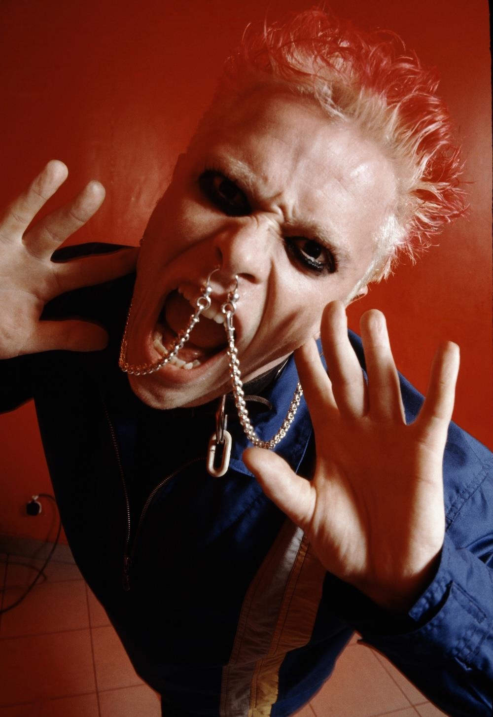 A limited edition of Keith Flint, Prodigy close up and shouting into the lens.