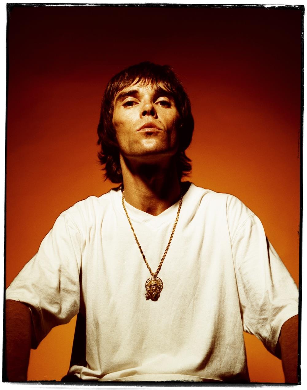 A limited edition colour print of Ian Brown, Stone Roses posing for the camera in 1998..