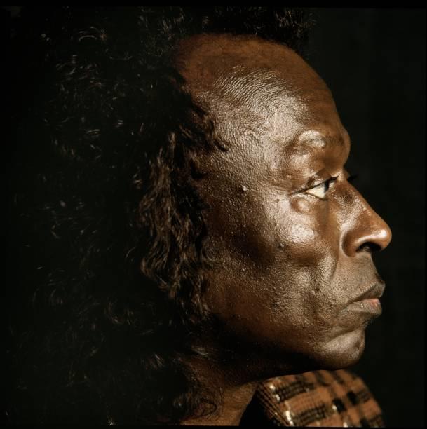 A limited edition colour print of Miles Davis showing the musician in profile.
