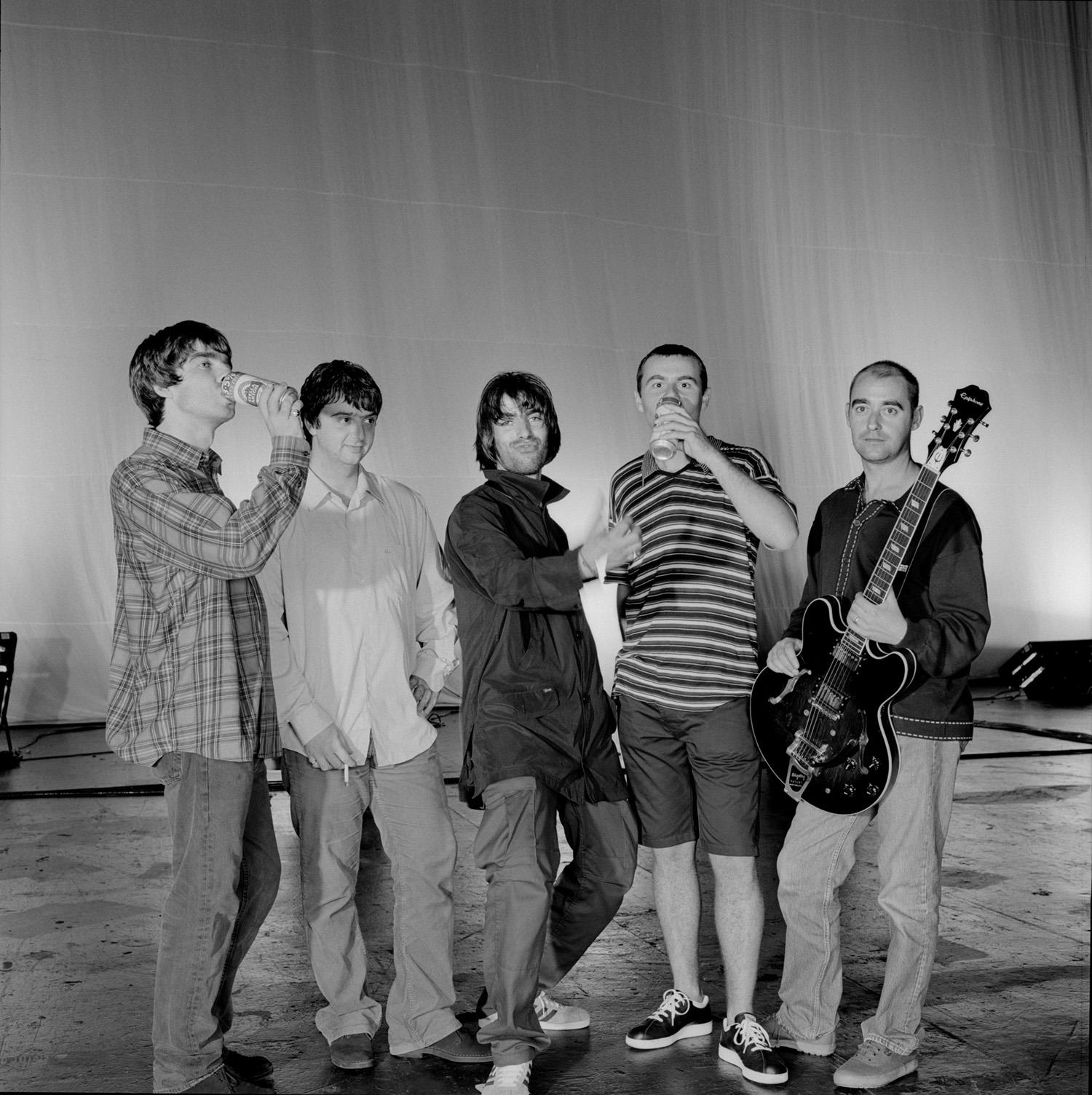 A limited edition of a group shot of Oasis taken at the NEC during their Knebworth rehersals.
