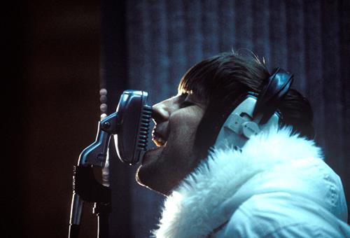 A limited edition print of a close-up of Liam Gallagher, Oasis singing into the microphone.